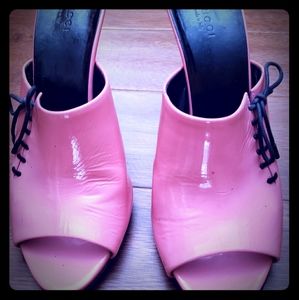 Hot pink Gucci slippers with a black tie on side